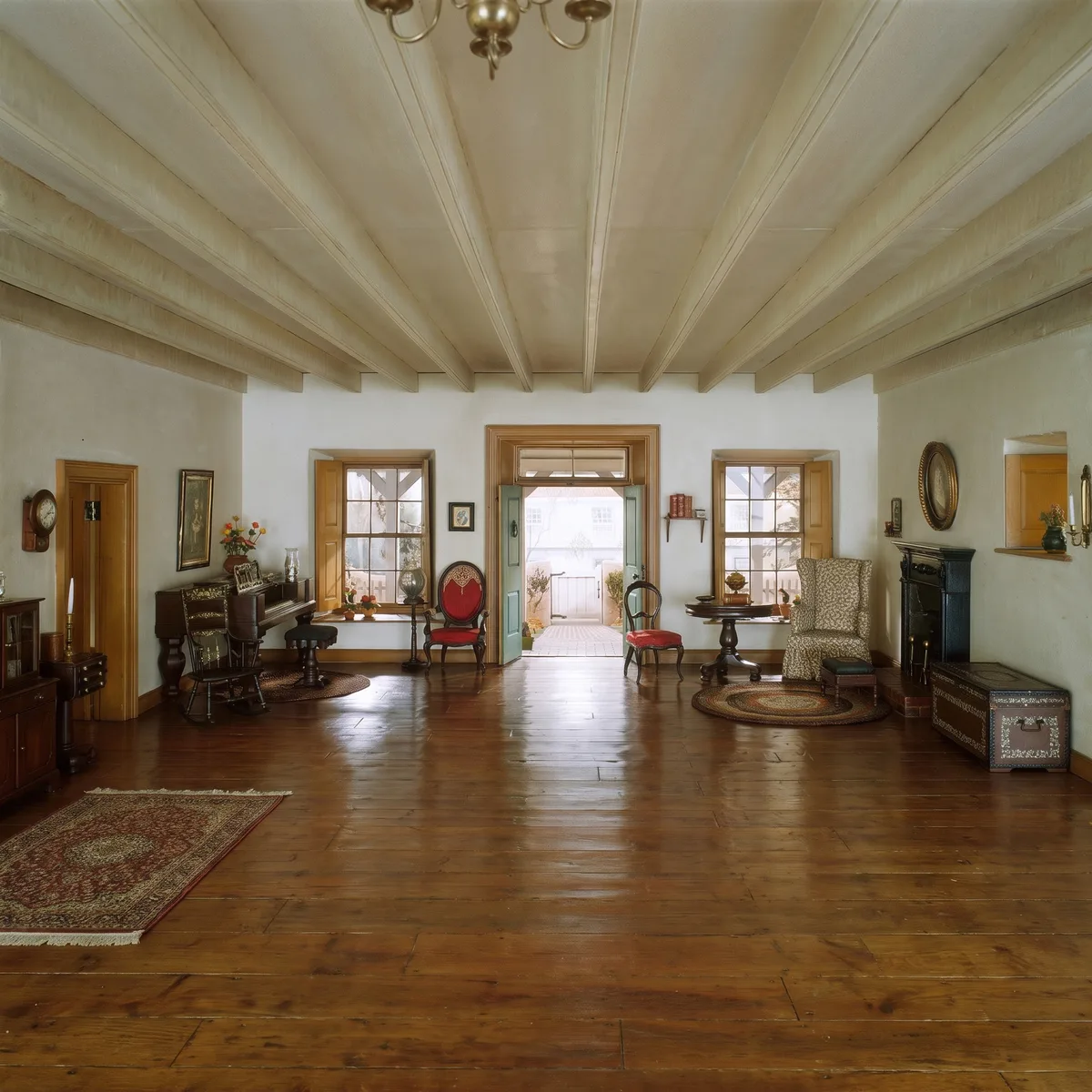 The living room as a square, ceiling beams and floorboards continued in line